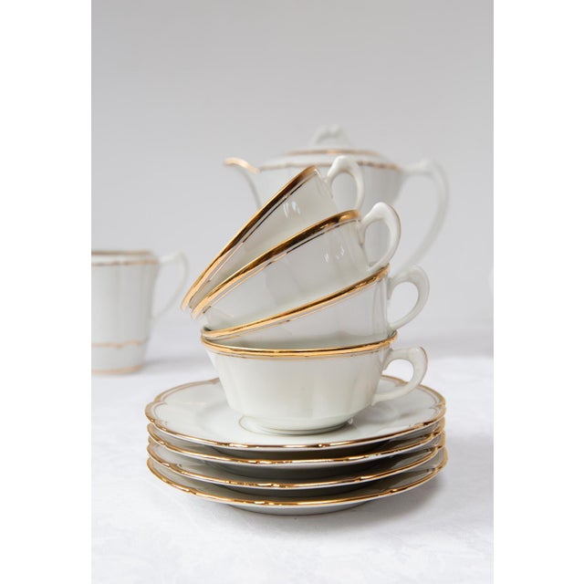 It consists of the following 11 pieces: 4 cups: ⌀ 9.5 cm, 4.5 cm high 4 saucers: ⌀ 15 cm 1 sugar bowl: 17 × 12 × 11.5 cm...
