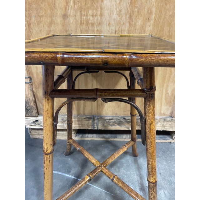 Splendid vintage bamboo tea table with coromandel top. This elegant piece is comprised of bamboo legs and framed around a...