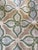 Green and blue ogee-style pattern on a beige background. Remnant measures 62x54