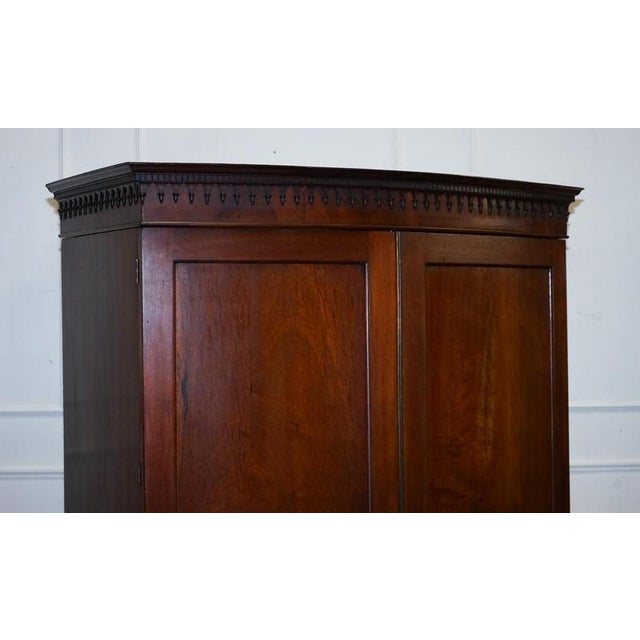 A beautifully crafted English George III linen press, later converted into a practical and spacious wardrobe while...