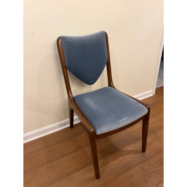 Hammer Fine Furniture custom armless chair. Features blue fabric upholstered seat and back with an exquisite dark wood frame.
