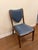 Hammer Fine Furniture custom armless chair. Features blue fabric upholstered seat and back with an exquisite dark wood frame.