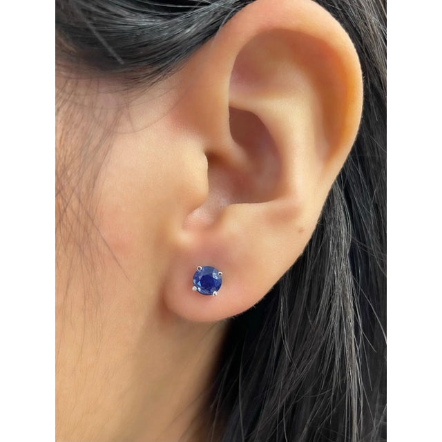 These stunning sapphire stud earrings feature 2 sapphires weighing 1.23 ct set in 14k white gold.