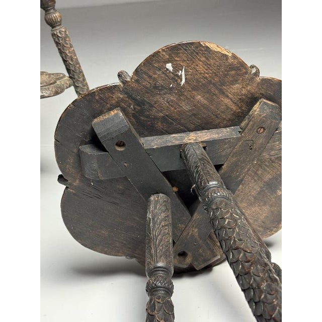 Set of 2 richly decorated side tables. Hand-carved, solid teak wood. India, early 20th century. Very heavy, solid, and...