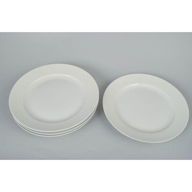 Axel Salto for Royal Copenhagen, set of four dinner plates. Elegant set of four porcelain dinner plates with refined...