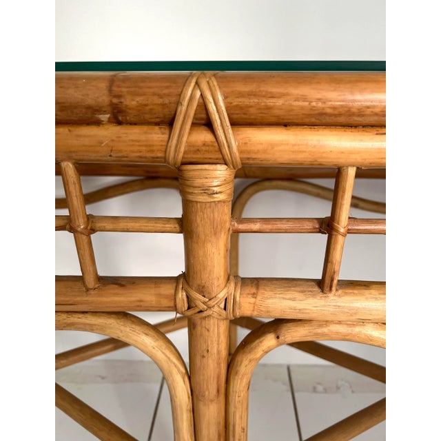 Lovely boho chic Rattan Console with thick glass top. Nice long size measures 60” in length.