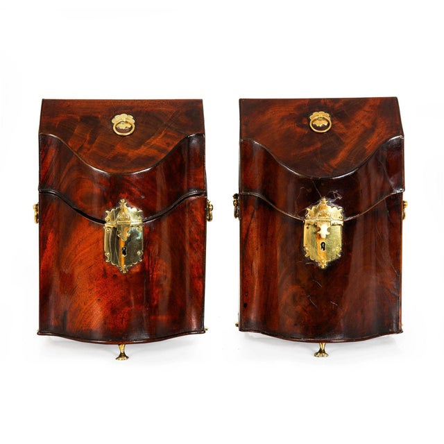 GEORGE III FLAMED MAHOGANY SERPENTINE BOXES ON ANIMAL FEET England, circa 1780 | the cutlery divider removed, otherwise...