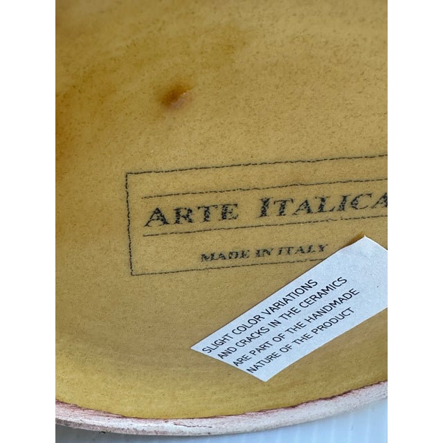 13" tall Mustard color Jar with a Lid by Arte Italica, featuring a Design of Grapes and Leaves. Made in Italy, this...