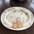 A large polychrome transfer ware serving platter from Copeland in 1877. This piece is decorated with colorful palms and...