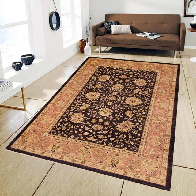 "Enhance the ambiance of your home with this magnificent Persian-influenced Turkish hand-knotted rug made by skilled...