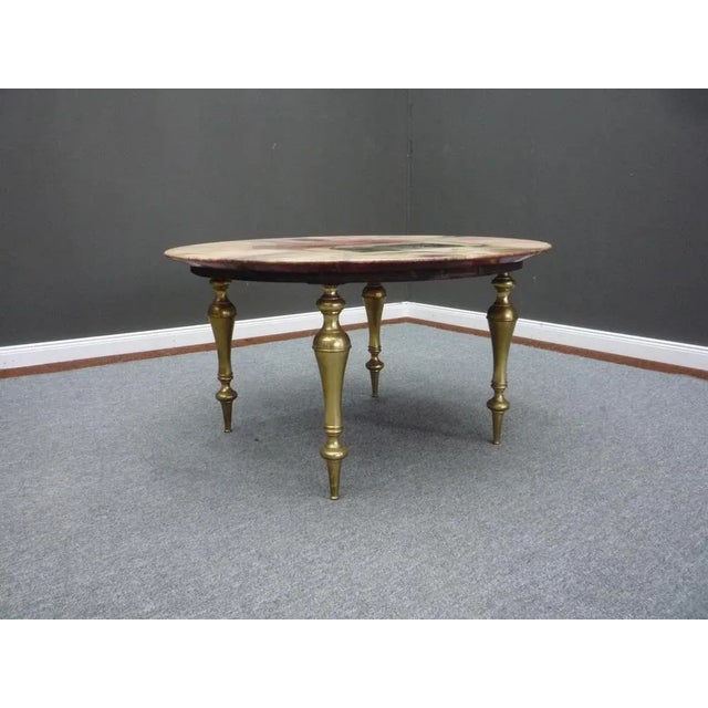 Rare coffee table by Aldo Tura. Table legs solid brass with some patina and minor traces of wear. The coffee table is over...