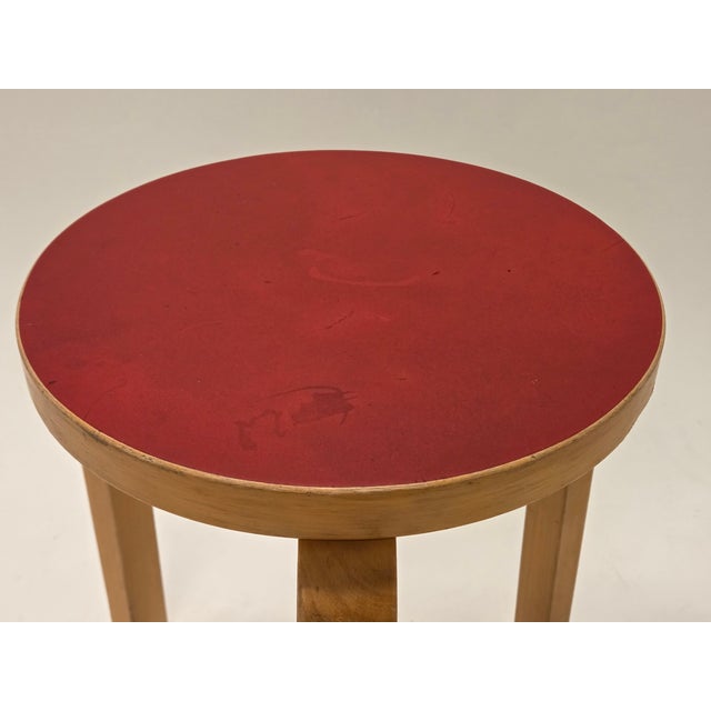Artek 60 stool, birch with red linoleum. The stool is from around the 1950s. Designer Alvar Aalto. Good used condition. I...