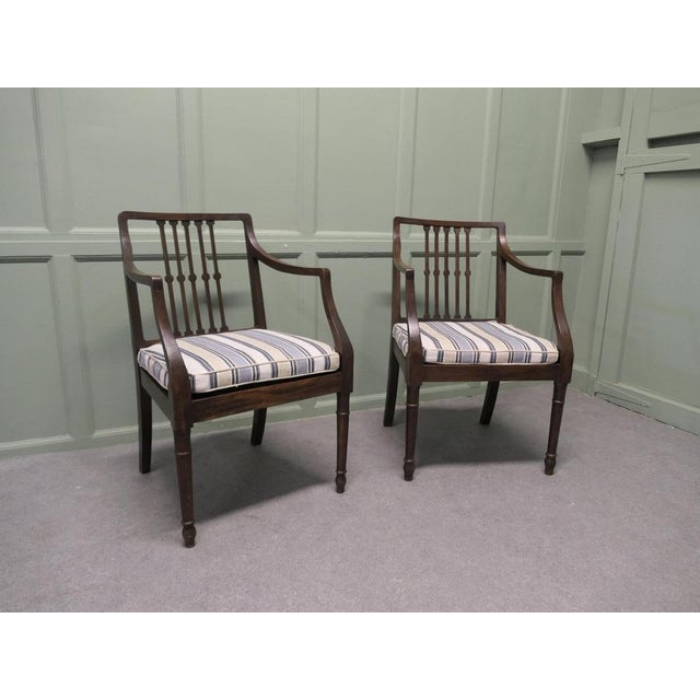 A Pair of Regency Elbow Chairs, Hall Chairs These beautiful chairs are made in Oak, they have newly covered loose...