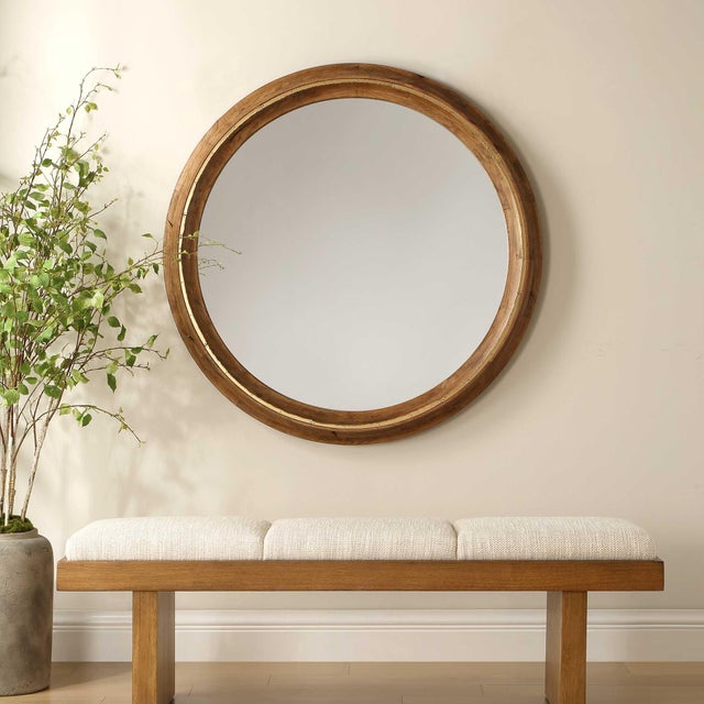 The Frontier Round Mirror Features A Solid Wood Frame Finished In A Light Honey Stain, Accented With Antique Gold Iron...