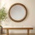 The Frontier Round Mirror Features A Solid Wood Frame Finished In A Light Honey Stain, Accented With Antique Gold Iron...