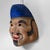 Decorative Japanese papier-mâché mask, dating from the 1950s–1960s. The mask represents Ebisu, or Ebisu-sama, one of the...
