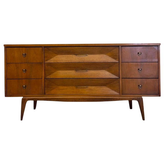 Embodying the peak of mid-century design, this exceptional vintage nine-drawer dresser or credenza seamlessly balances...