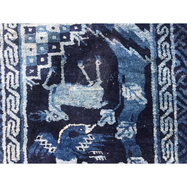 Beautiful little late 19th century Chinese rug with a Chinese design with dogs, and beautiful colors with blue, entirely...