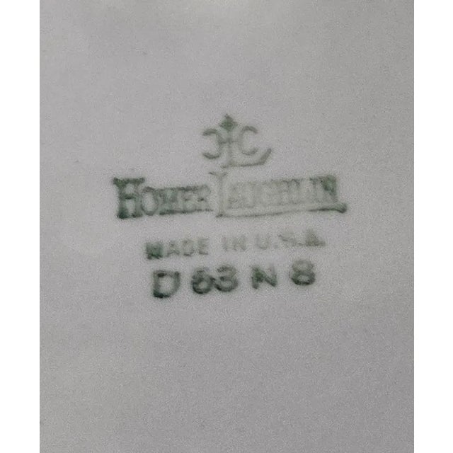 This is Homer Laughlin's timeless pink dogwood china. Pink and white dogwood on their branches, adorning creamy white...