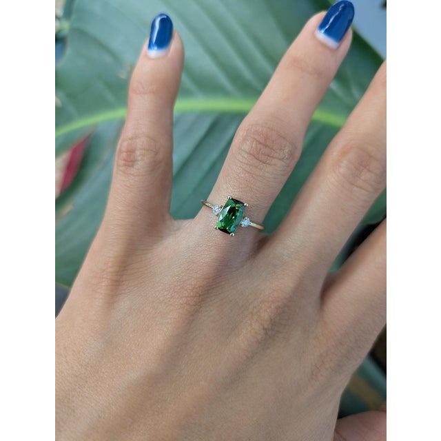 Vibrant 1.3ct chrome tourmaline set in solid 14K gold, accented with earth-mined diamonds. A stunning fusion of rich color...