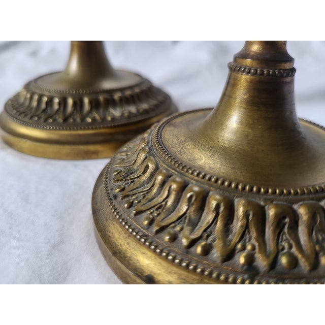 An exceptional and highly rare pair of French neoclassical candlesticks dating back to the late Louis XV/early Louis XVI...