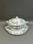 An elegant vintage porcelain soup tureen with a matching fitted lid and undertray platter from the renowned Portuguese...