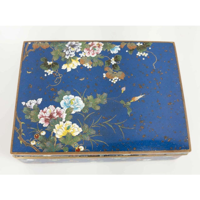 We are selling this fine Japanese cloisonne enamel box. This gilt bronze box has very fine and elaborate Cloisonne work of...