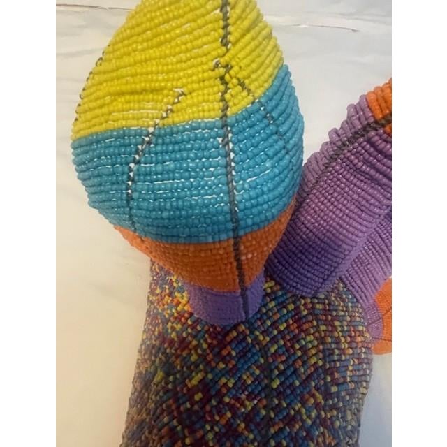 Bring a vibrant burst of color and artisanal soul to your walls with this magnificent hand-beaded Kudu trophy head....