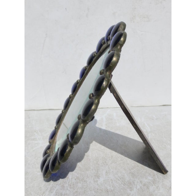 Pewter and glass beads formed an oval. A Glass oval face with a beveled edge. The backboard is set in place by screws and...