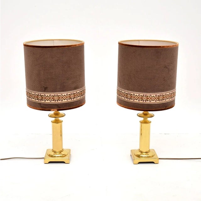 A stylish and extremely well made pair of vintage brass table lamps with velvet shades. They were made in France, they...