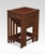 Nest of four Chinese rosewood tables each with a recessed rectangular paneled top and carved frieze on four slender...