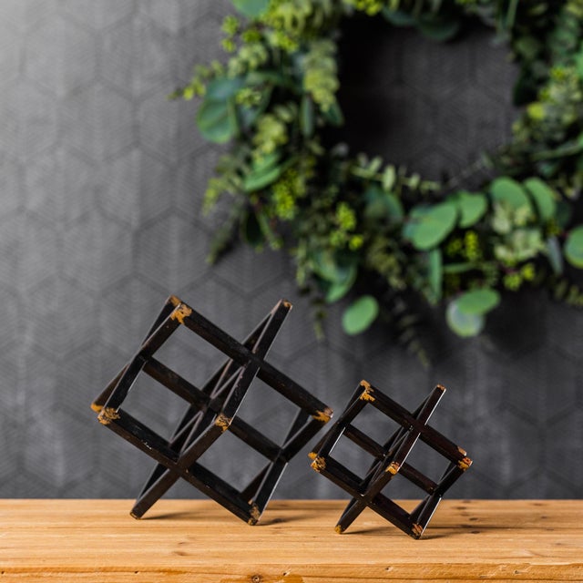 Add a sophisticated sparkle to your space with this set of Modern Metal Star Sculptures. Featuring striking black and gold...