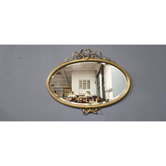 A super quality early Victorian oval gilt mirror with ribbon detailing, bevelled glass, in overall great original...