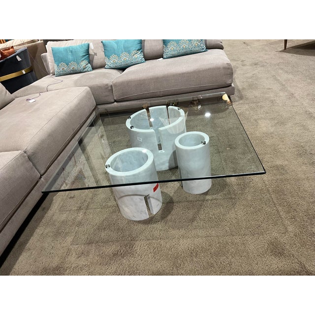 Make a sophisticated statement with this stunning Carrara Marble Base Coffee Table, featuring a sleek, clear glass top...