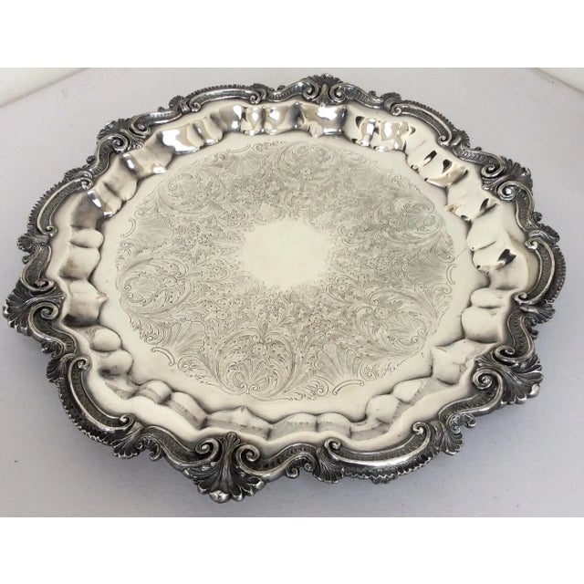 This is a beautiful thick round Tray with a footed base and amazing detailed design. The Copper shows in a few areas from...
