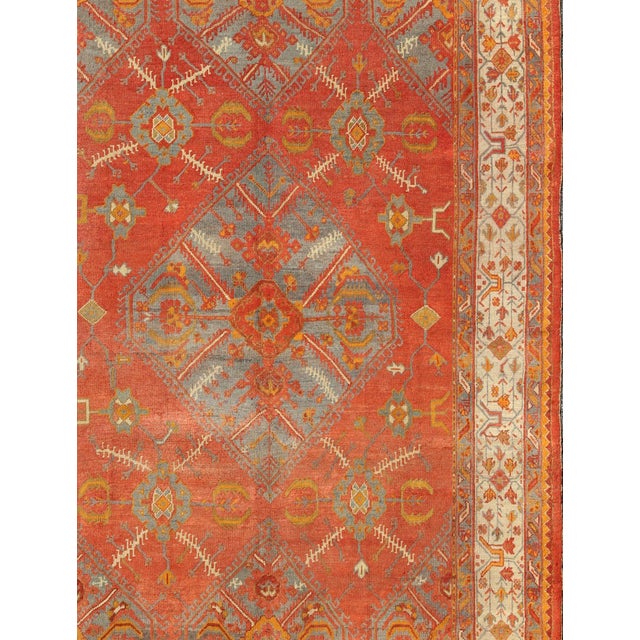 Antique Turkish Oushak rug with tribal Medallion design in terracotta, light gray blue, ivory and gold. Keivan Woven Arts...