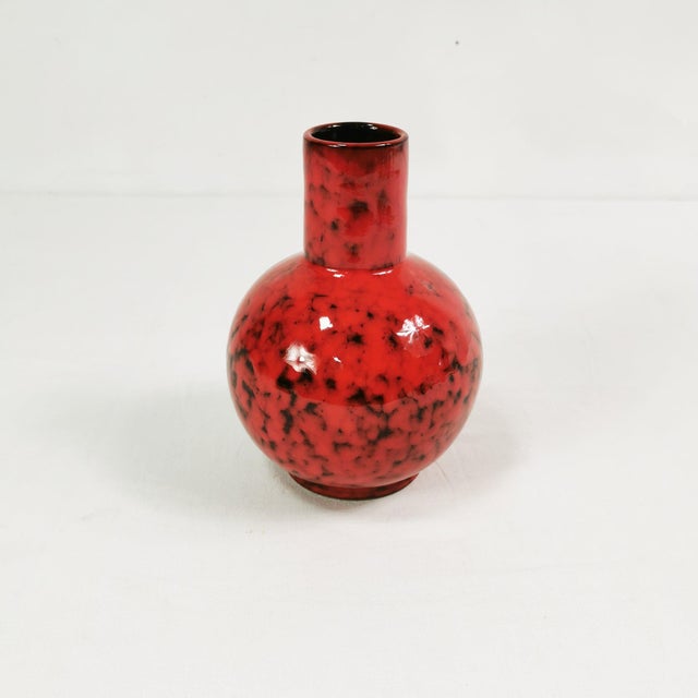 Vase of Italian origin, dating to the 1960s; bears a signature on the underside. It is characterized by bold coloring and...