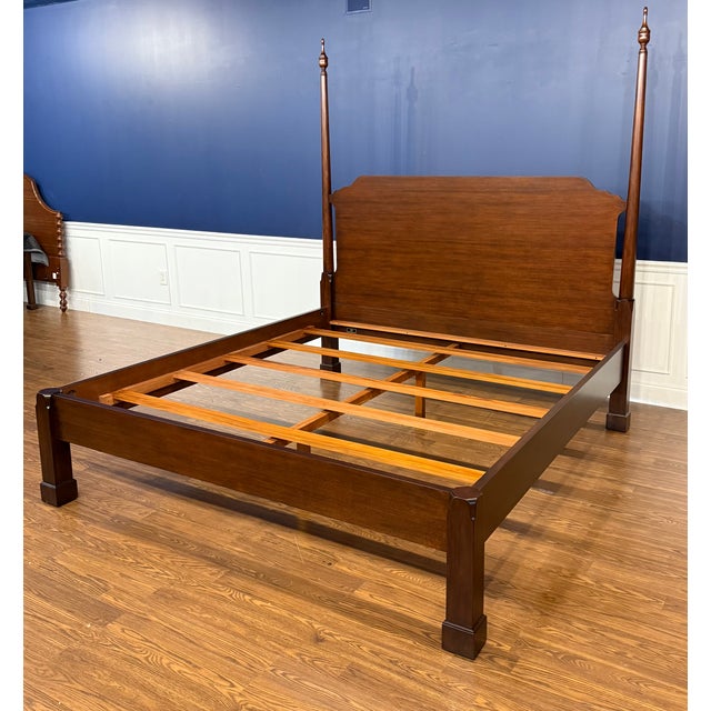 This is a traditional mahogany king size Pencil Post bed by Leighton Hall. It features classic clean lines with round...