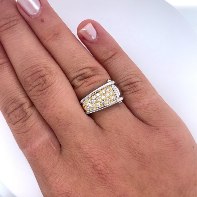 Natural round-cut diamond cluster in two-toned 18k yellow gold and platinum. Featuring an ascending ring face and smooth...
