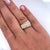 Natural round-cut diamond cluster in two-toned 18k yellow gold and platinum. Featuring an ascending ring face and smooth...
