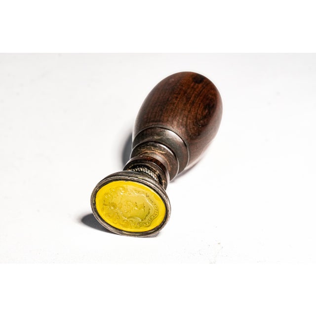 An elegant and highly decorative 19th century antique desk wax seal featuring a beautifully turned hardwood handle mounted...