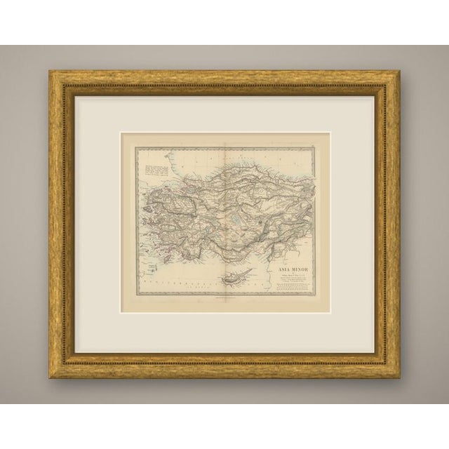 An original antique map of asia minor, a steel engraving colored by hand, with red outline color for the provincial...