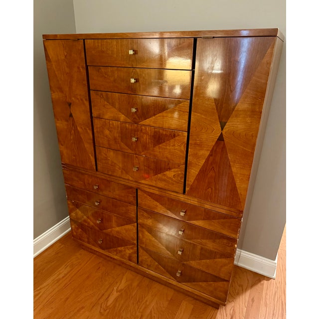 Stunning Henredon gentleman's chest with dramatic bookmatched diamond/chevron veneer pattern and original brass grid-style...