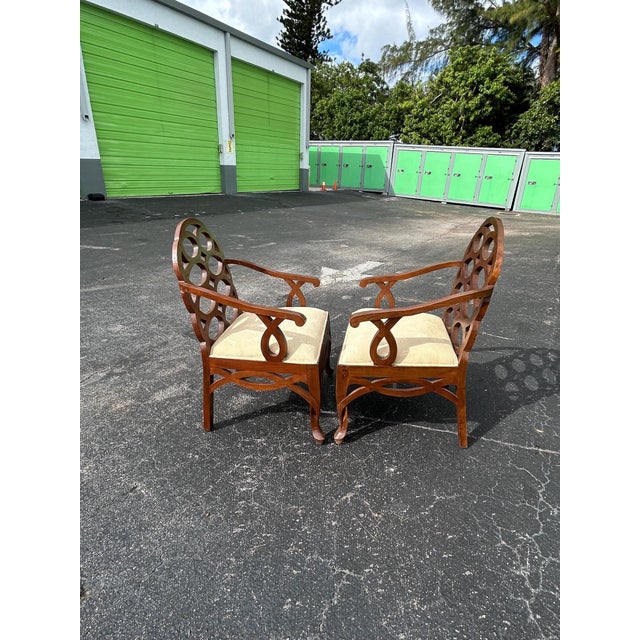 Pair of dark wood Francis Elkins style loop design arm chairs. These are an oversized chair that is quite substantial....