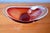 Designed by Paul Kedelv for Sölvehyttan, this bowl with its raised rim, crafted from cherry red and clear colored glass,...