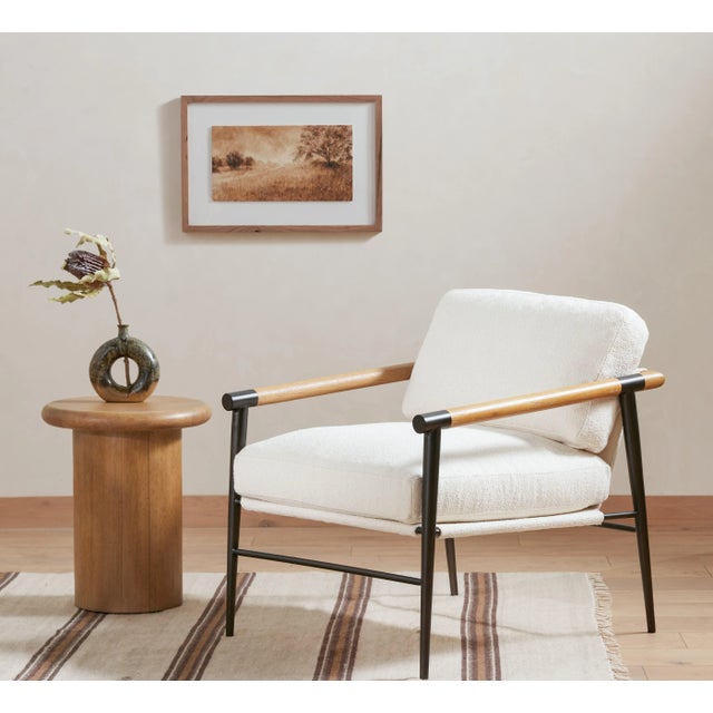 Turn up the volume. A cylindrical pedestal-style base of solid burnished parawood supports a rounded tabletop with...