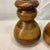These are vintage mid-century modern hand-turned segmented wood candle holders featuring a stacked bulbous silhouette and...