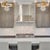 Mia 3-arm chandelier from Louise Gaskill Company. Made with vintage white Fenton coin dot glass and gold gilt flowers. The...