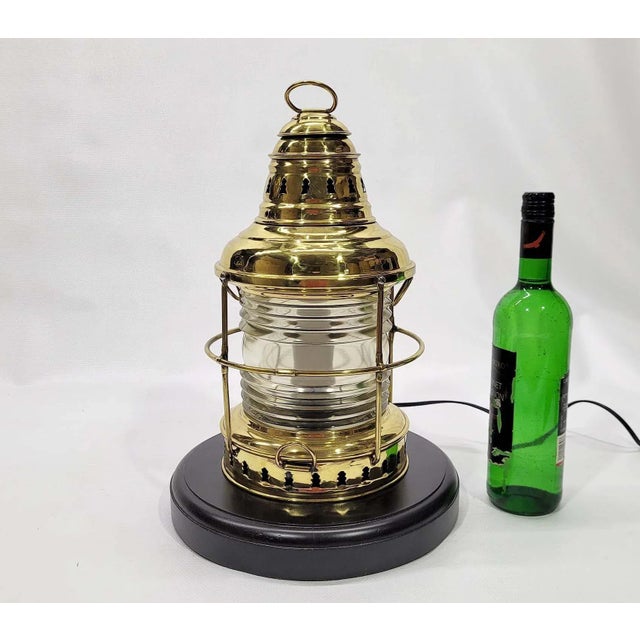 Solid brass marine lantern with Fresnel glass lens. Protective brass cage. This lantern has been meticulously polished and...