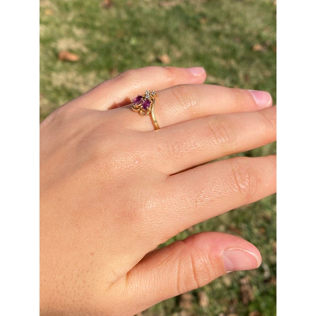 The 197th Avenue: Ruby and Natural Diamond Flare Ring in Yellow Gold. Introducing our striking ring featuring two oval...